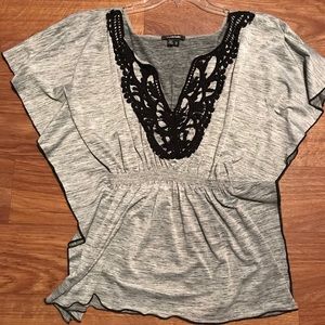 Grey and black fit and flare shirt.